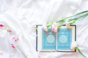 blue and green book on white textile